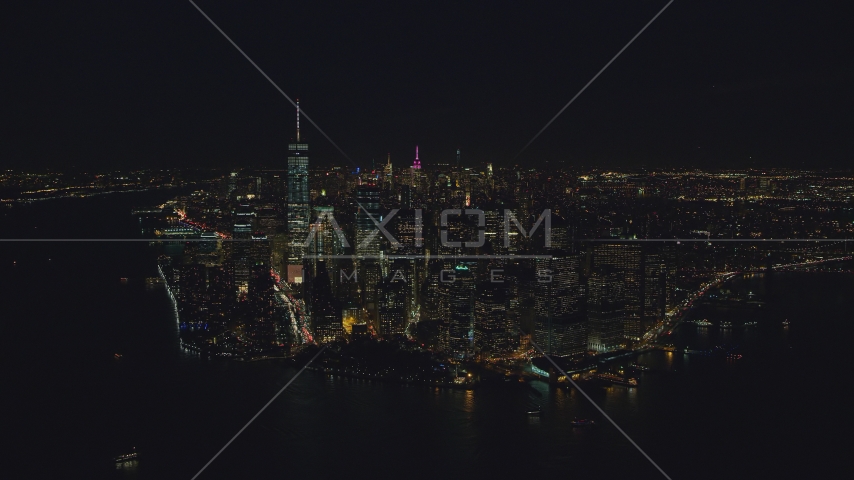 Lower Manhattan skyscrapers at night in New York City Aerial Stock Photo AX121_193.0000245F | Axiom Images