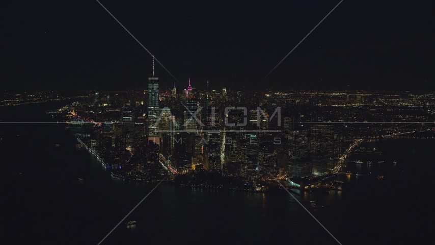 Lower Manhattan at night, seen from New York Harbor in New York City Aerial Stock Photo AX121_194.0000066F | Axiom Images