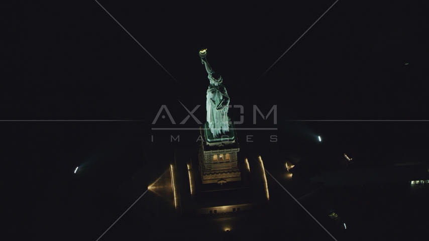 The side of the Statue of Liberty at night in New York Aerial Stock Photo AX121_195.0000229F | Axiom Images
