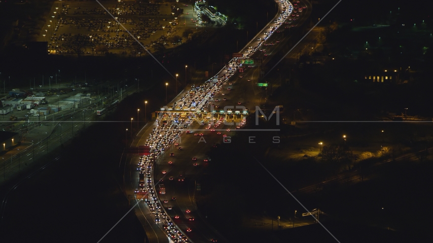Heavy traffic at a Jersey City toll station at night, New Jersey Aerial Stock Photo AX121_199.0000070F | Axiom Images