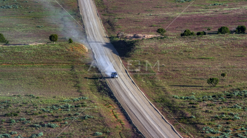 A view of a silver SUV on Hatch Point Road, Moab, Utah Aerial Stock Photo AX138_223.0000014 | Axiom Images