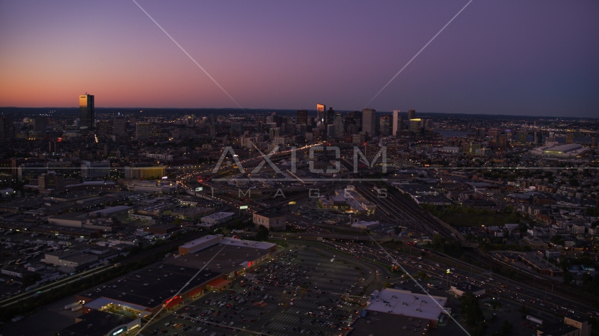 Heavy traffic near Downtown Boston skyline, Massachusetts, twilight Aerial Stock Photo AX141_015.0000000 | Axiom Images