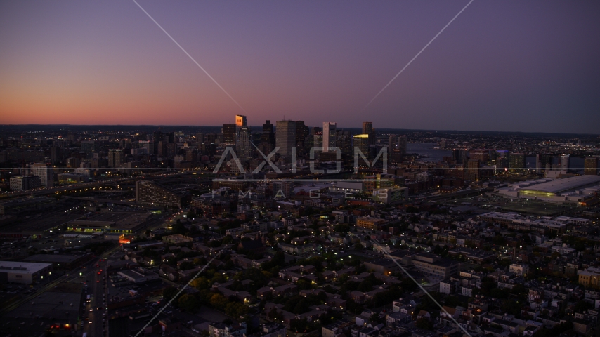 The city skyline's skyscrapers and streets in Downtown Boston, Massachusetts, twilight Aerial Stock Photo AX141_016.0000284 | Axiom Images