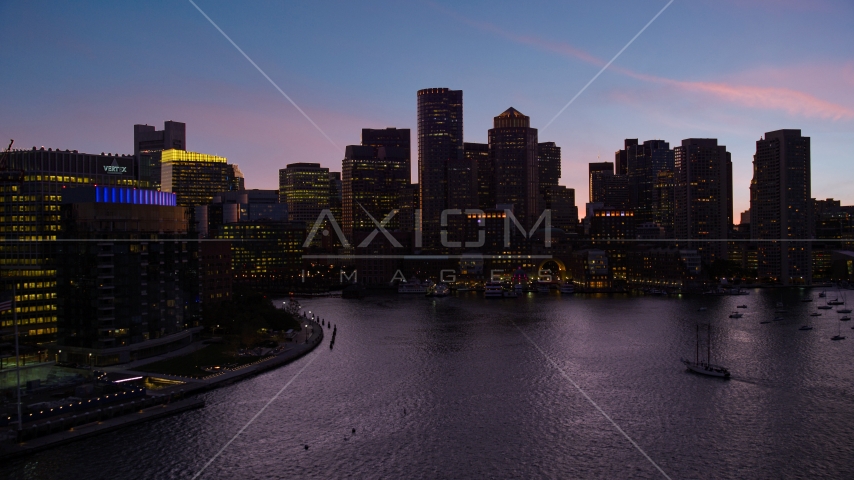 The skyline seen from over the harbor, Downtown Boston, Massachusetts, twilight Aerial Stock Photo AX141_023.0000301 | Axiom Images