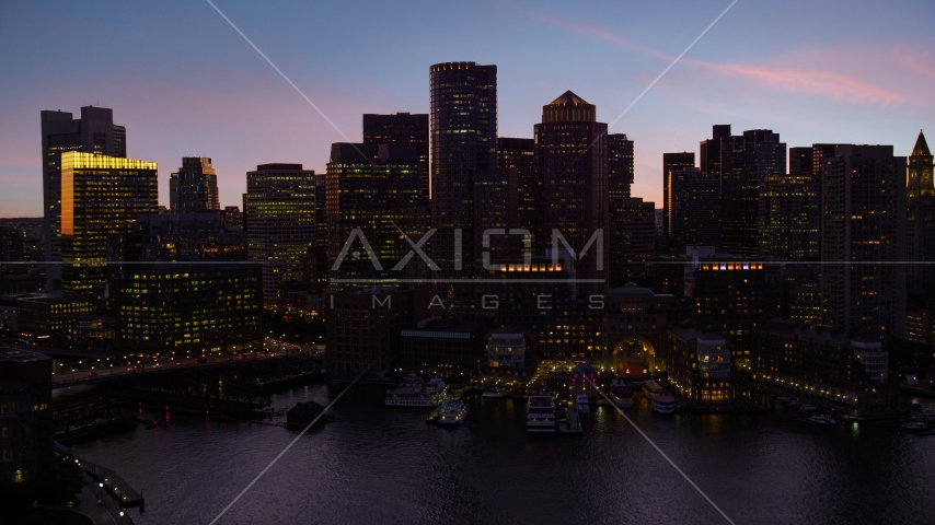 Skyline and Rowes Wharf, Downtown Boston, Massachusetts, twilight Aerial Stock Photo AX141_024.0000168 | Axiom Images