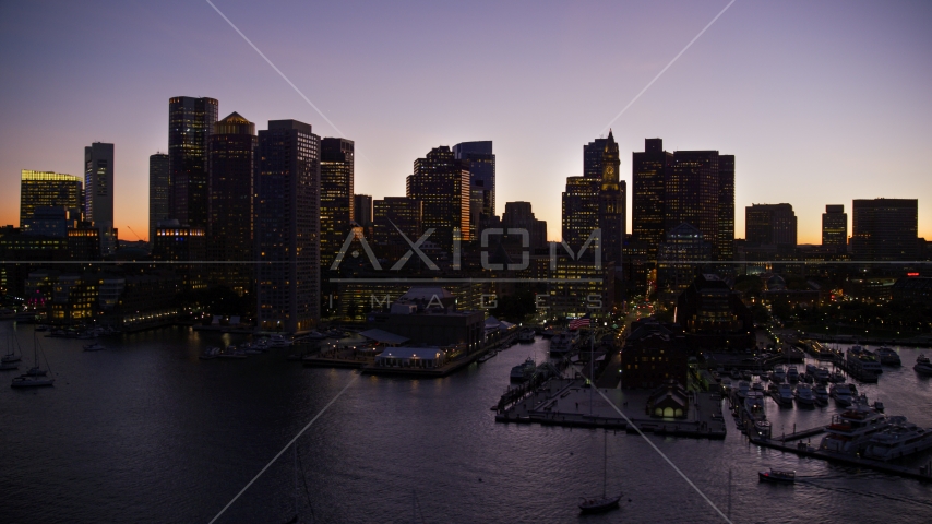 Skyscrapers of the waterfront skyline of Downtown Boston, Massachusetts, twilight Aerial Stock Photo AX141_031.0000279 | Axiom Images