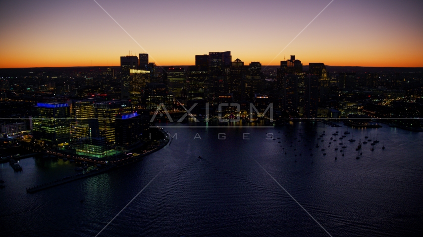 Boats in harbor and the skyline of Downtown Boston, Massachusetts, twilight Aerial Stock Photo AX141_046.0000341 | Axiom Images