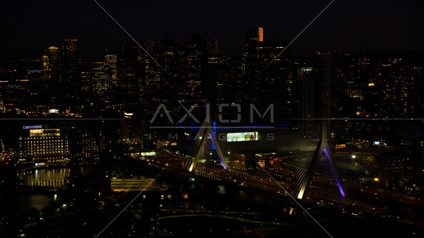 Zakim Bridge, TD Garden arena, Avalon North Station and Downtown Boston skyline, Massachusetts, night Aerial Stock Photo AX141_073.0000126 | Axiom Images