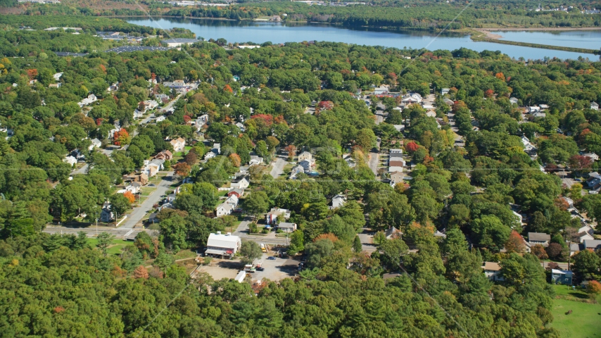 Small town neighborhoods and trees in autumn, Randolph, Massachusetts Aerial Stock Photo AX143_004.0000035 | Axiom Images