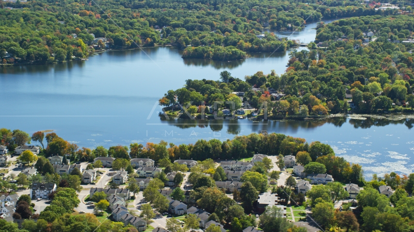 A small town on the shore of Whitmans Pond in autumn, Weymouth, Massachusetts Aerial Stock Photo AX143_015.0000125 | Axiom Images