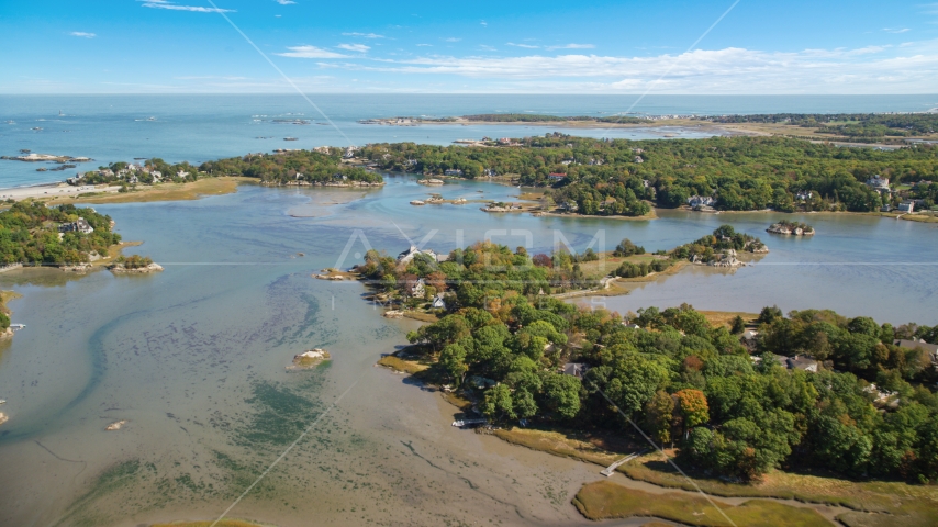 Small town, waterfront homes and a small lake in autumn, Cohasset, Massachusetts Aerial Stock Photo AX143_025.0000230 | Axiom Images