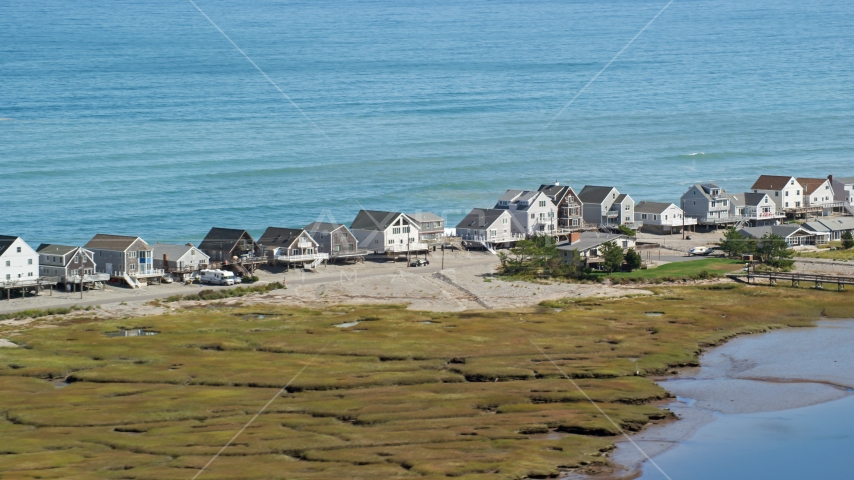 A row of elevated oceanfront homes, Humarock, Massachusetts Aerial Stock Photo AX143_049.0000000 | Axiom Images