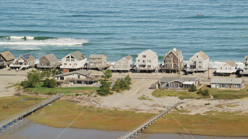 Elevated homes by the ocean, Humarock, Massachusetts Aerial Stock Photo AX143_049.0000422 | Axiom Images