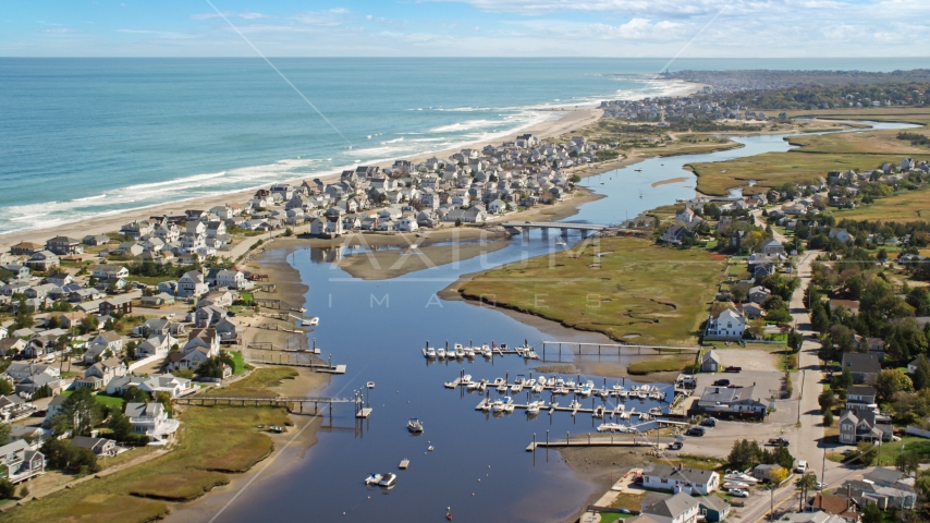 A small community on the coast beside Broad Creek and a small bridge, Humarock, Massachusetts Aerial Stock Photo AX143_051.0000349 | Axiom Images
