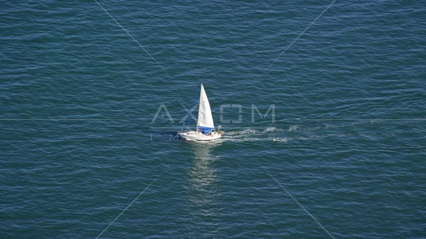 A small sailing boat on Cape Cod Bay, Massachusetts Aerial Stock Photo AX143_125.0000349 | Axiom Images