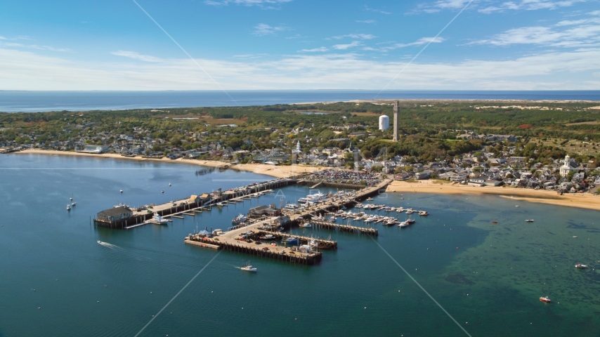 Piers and a small coastal town seen from the bay, Provincetown, Massachusetts Aerial Stock Photo AX143_232.0000117 | Axiom Images