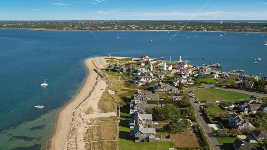 Oceanfront homes and Nantucket Harbor Lights, Nantucket, Massachusetts Aerial Stock Photo AX144_088.0000000 | Axiom Images