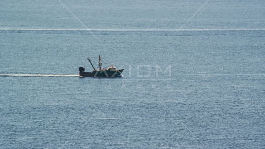 A fishing boat on the Atlantic Ocean Aerial Stock Photo AX144_167.0000000 | Axiom Images