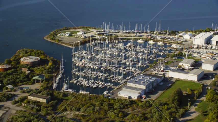 Boats at a marina by warehouses in Portsmouth, Rhode Island Aerial Stock Photo AX145_006.0000321 | Axiom Images