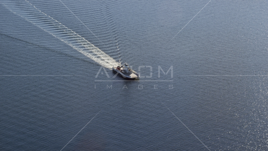 A car ferry cruising across the water in Portsmouth, Rhode Island Aerial Stock Photo AX145_011.0000279 | Axiom Images
