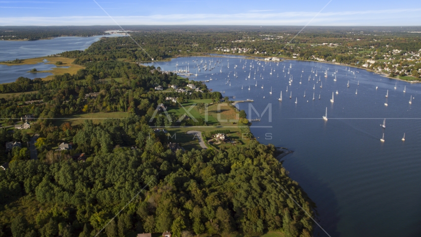 Waterfront mansions near sailboats in Bristol Harbor, Bristol, Rhode Island Aerial Stock Photo AX145_013.0000000 | Axiom Images
