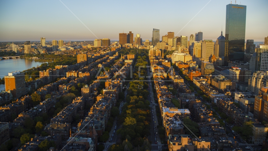 Back Bay brownstones and Downtown Boston skyscrapers, Massachusetts, sunset Aerial Stock Photo AX146_062.0000288F | Axiom Images