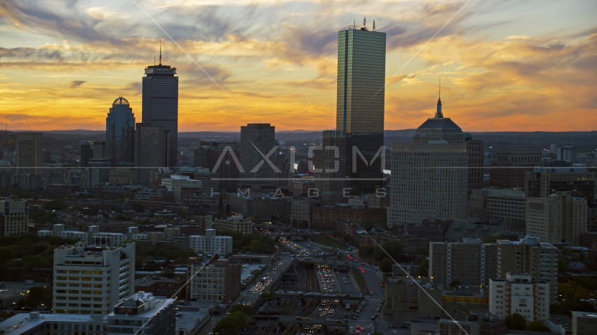 A view of tall downtown skyscrapers at sunset in Downtown Boston, Massachusetts Aerial Stock Photo AX146_114.0000047F | Axiom Images