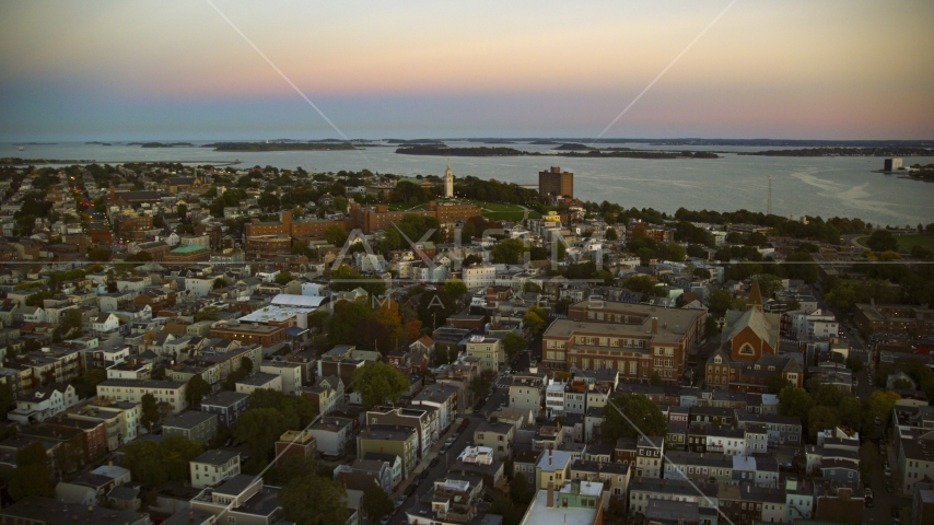 The Dorchester Heights Monument and row houses, South Boston, Massachusetts, twilight Aerial Stock Photo AX146_115.0000303F | Axiom Images