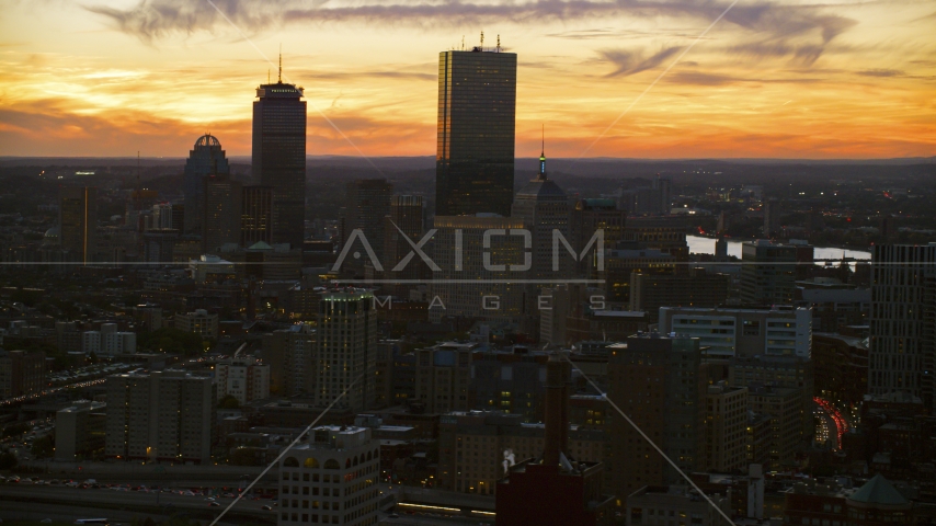 Towering skyscrapers and city buildings at twilight in Downtown Boston, Massachusetts Aerial Stock Photo AX146_137.0000054F | Axiom Images