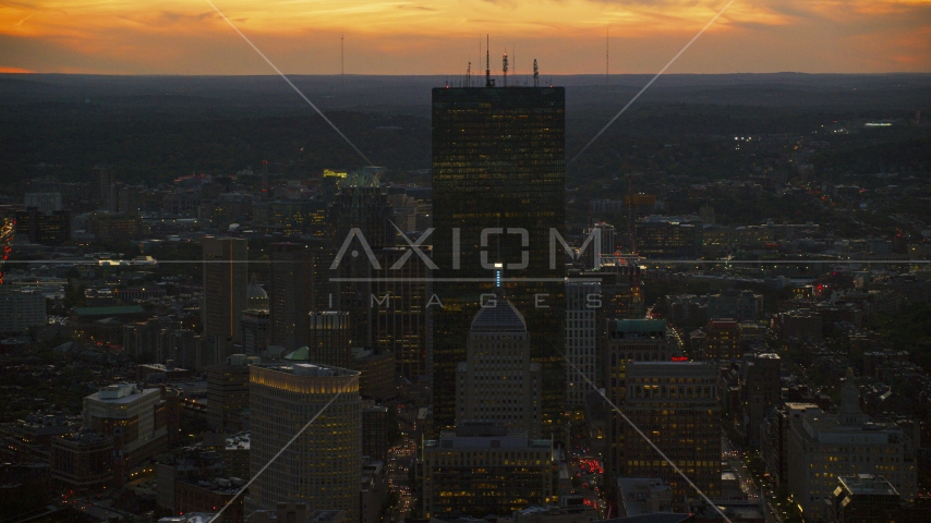 A tall skyscraper at twilight in Downtown Boston, Massachusetts Aerial Stock Photo AX146_142.0000169F | Axiom Images