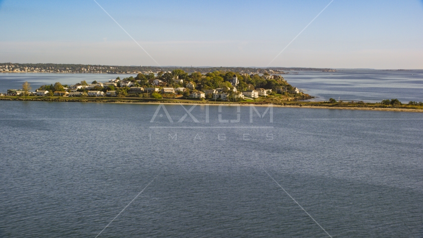 A coastal community nestled by trees on a peninsula in the bay, Nahant, Massachusetts Aerial Stock Photo AX147_016.0000000 | Axiom Images