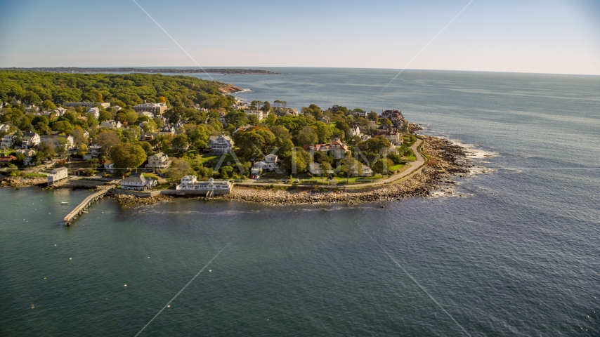 Oceanfront homes on a rocky coast in Gloucester, Massachusetts Aerial Stock Photo AX147_079.0000157 | Axiom Images