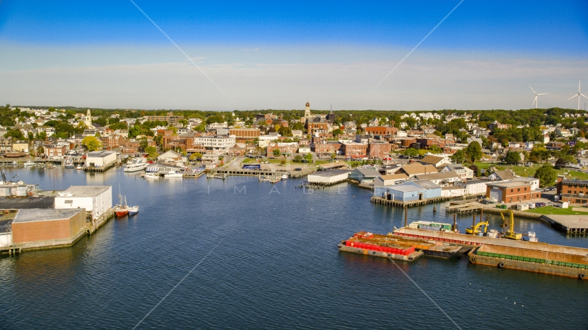 Coastal town, small warehouse buildings on the shore, Gloucester, Massachusetts Aerial Stock Photo AX147_087.0000376 | Axiom Images