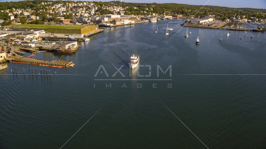 A ferry by a small coastal town, Gloucester, Massachusetts Aerial Stock Photo AX147_088.0000030 | Axiom Images