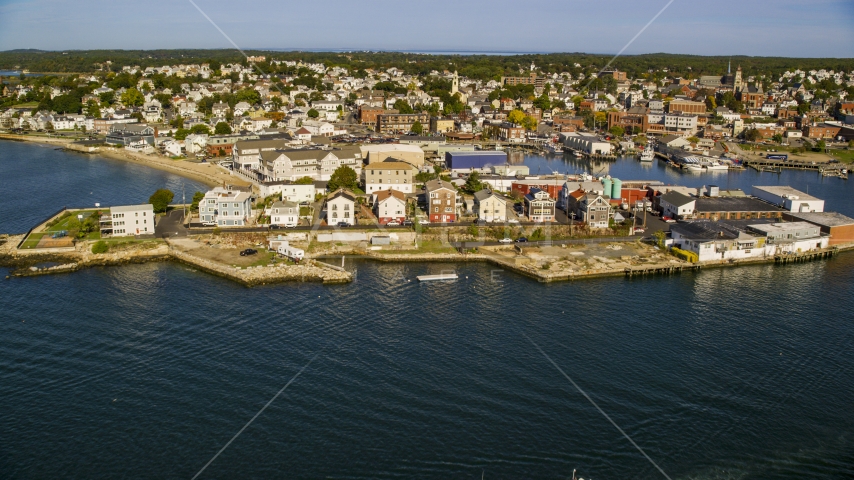 A coastal town with waterfront warehouses, Gloucester, Massachusetts Aerial Stock Photo AX147_099.0000000 | Axiom Images