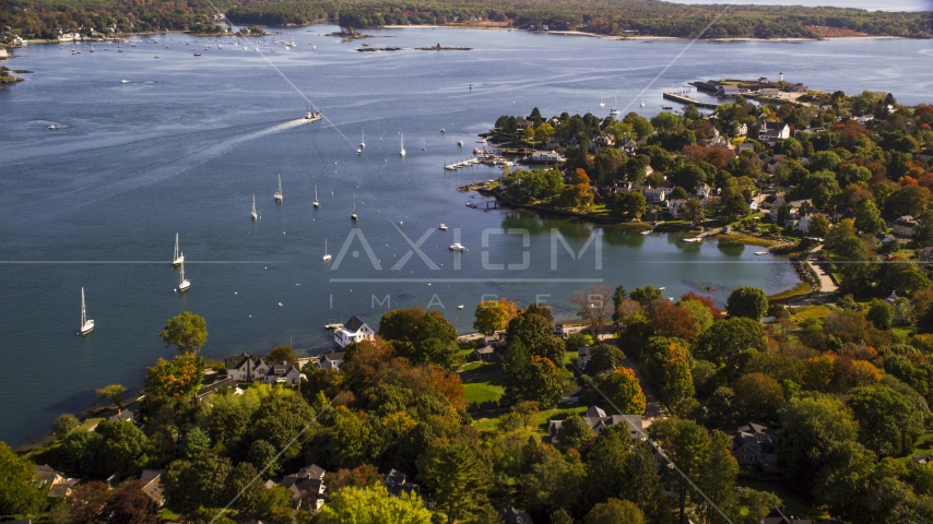 Coastal homes near sailboats in autumn, New Castle, New Hampshire Aerial Stock Photo AX147_189.0000357 | Axiom Images
