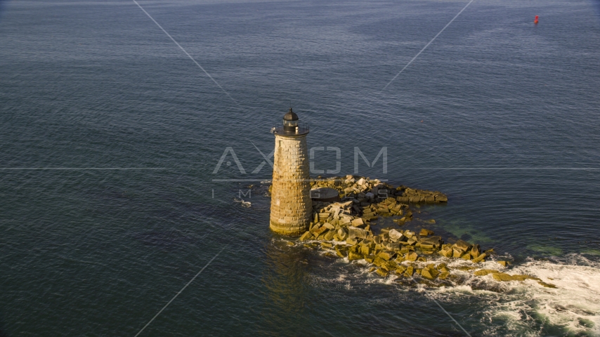 A lighthouse in the water by rocky shore, Kittery, Maine Aerial Stock Photo AX147_196.0000000 | Axiom Images