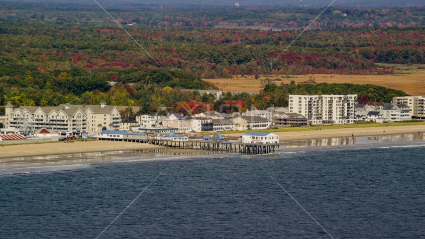 A beach and pier by colorful autumn trees, Old Orchard Beach, Maine Aerial Stock Photo AX147_295.0000000 | Axiom Images