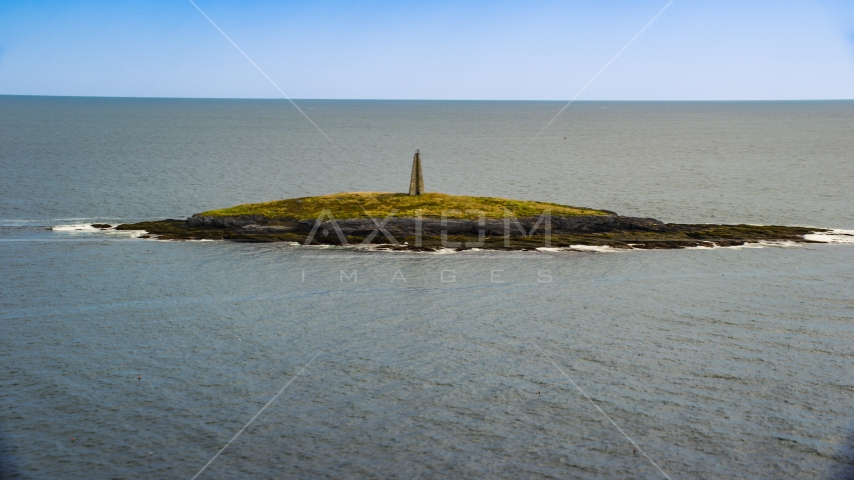 A lighthouse on Little Mark Island in the Atlantic Ocean, Harpswell, Maine Aerial Stock Photo AX147_377.0000000 | Axiom Images
