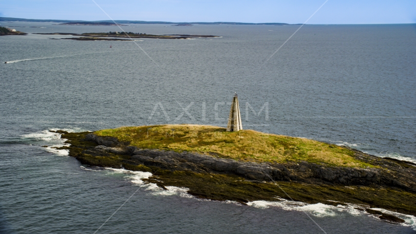 View of a lighthouse on Little Mark Island in the Atlantic Ocean, Harpswell, Maine Aerial Stock Photo AX147_377.0000158 | Axiom Images
