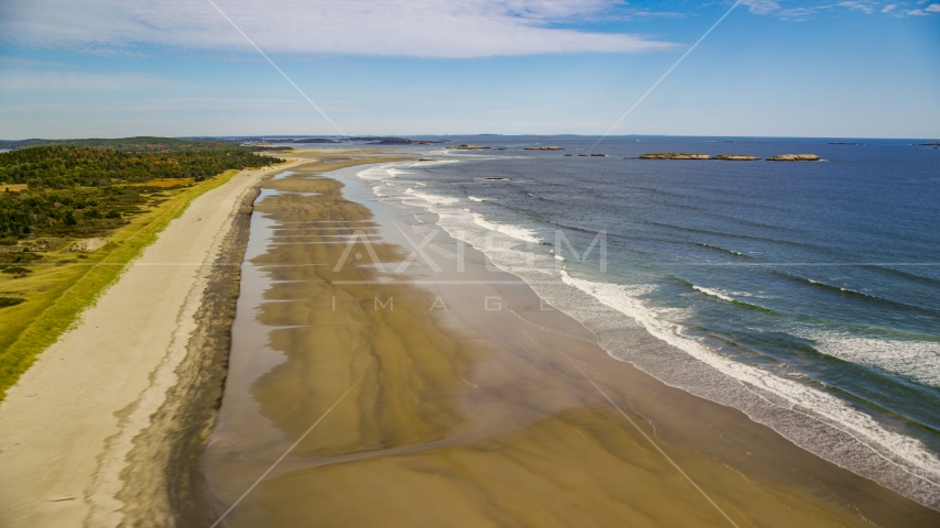 Waves rolling onto the beach in autumn, Phippsburg, Maine Aerial Stock Photo AX147_385.0000067 | Axiom Images