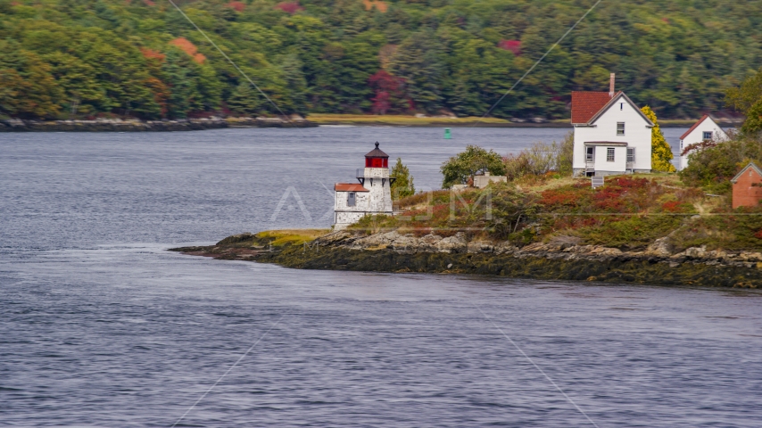 Squirrel Point Light beside the water in Arrowsic, Maine Aerial Stock Photo AX147_402.0000184 | Axiom Images