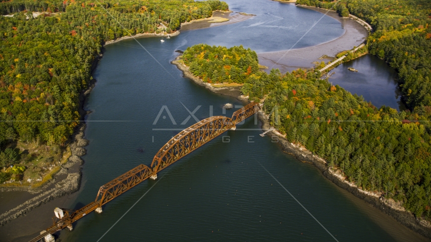 A small bridge spanning Sheepscot River, autumn, Newcastle, Maine Aerial Stock Photo AX148_006.0000050 | Axiom Images