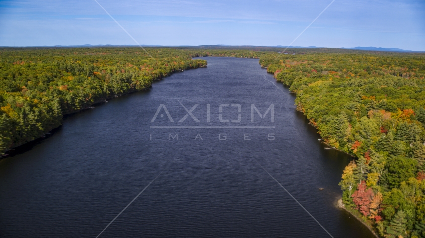 A colorful forest around Biscay Pond in autumn, Damariscotta, Maine Aerial Stock Photo AX148_022.0000212 | Axiom Images