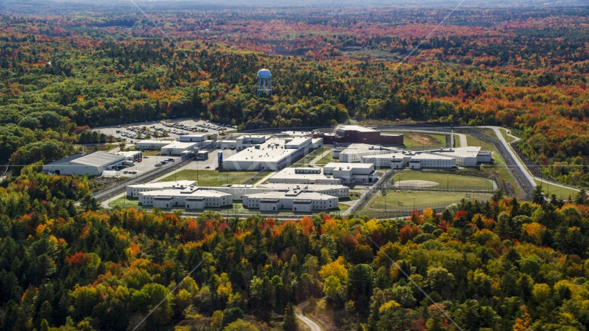 Maine State Prison surrounded by colorful forest, autumn, Warren, Maine Aerial Stock Photo AX148_065.0000000 | Axiom Images