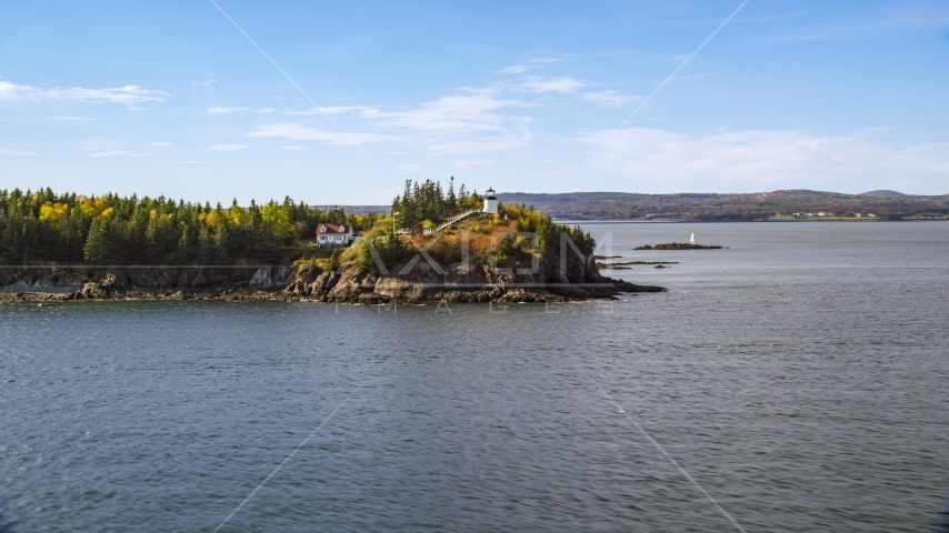 Owls Head Light and trees with partial fall foliage, autumn, Owls Head, Maine Aerial Stock Photo AX148_082.0000261 | Axiom Images