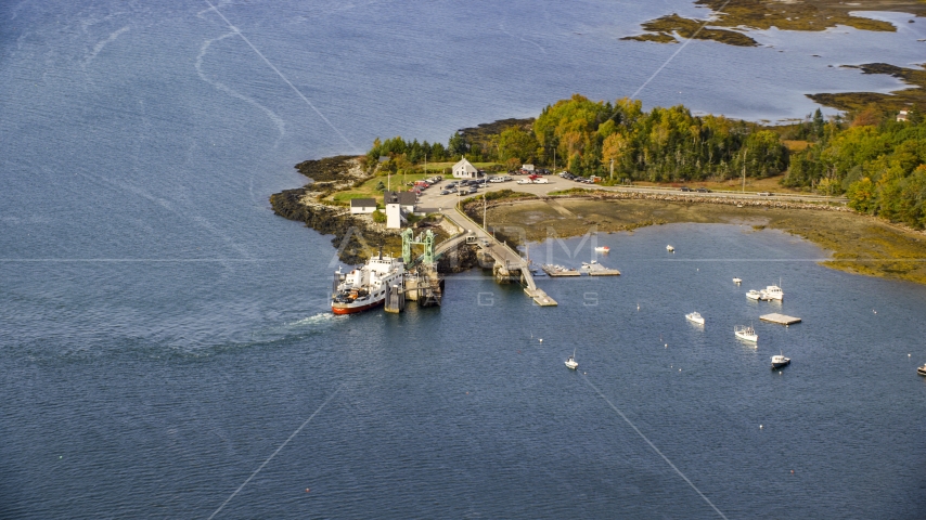 Grindel Point Light, ferry, and islands in autumn, Islesboro, Maine Aerial Stock Photo AX148_126.0000000 | Axiom Images