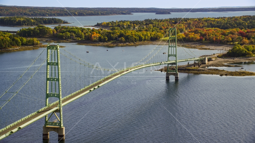 A view of the Deer Isle Bridge, colorful foliage, autumn, Maine Aerial Stock Photo AX148_143.0000045 | Axiom Images