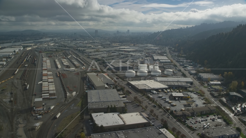 Warehouses and train yard in an industrial area, Northwest Portland, Oregon Aerial Stock Photo AX153_063.0000297F | Axiom Images