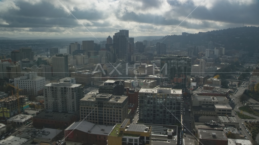 Downtown Portland skyscrapers on a cloudy day in Oregon Aerial Stock Photo AX153_069.0000359F | Axiom Images